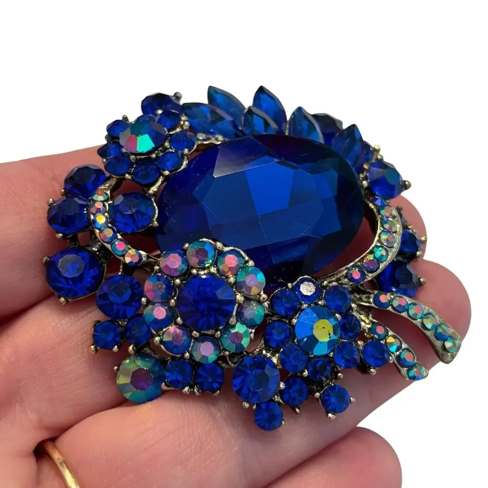 Vintage inspired chunky blue rhinestones brooch ornate silvertone AB finish